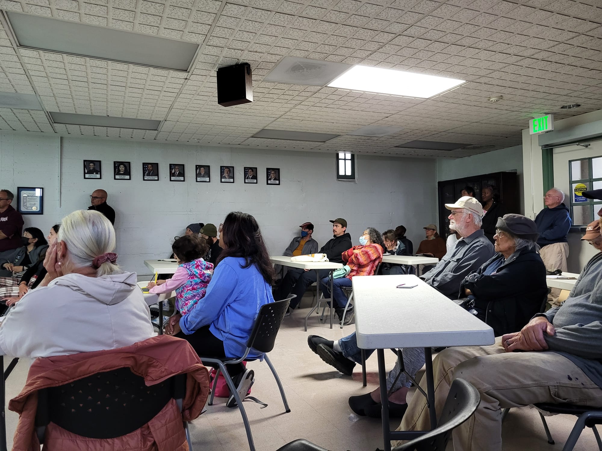 People seated and listening.