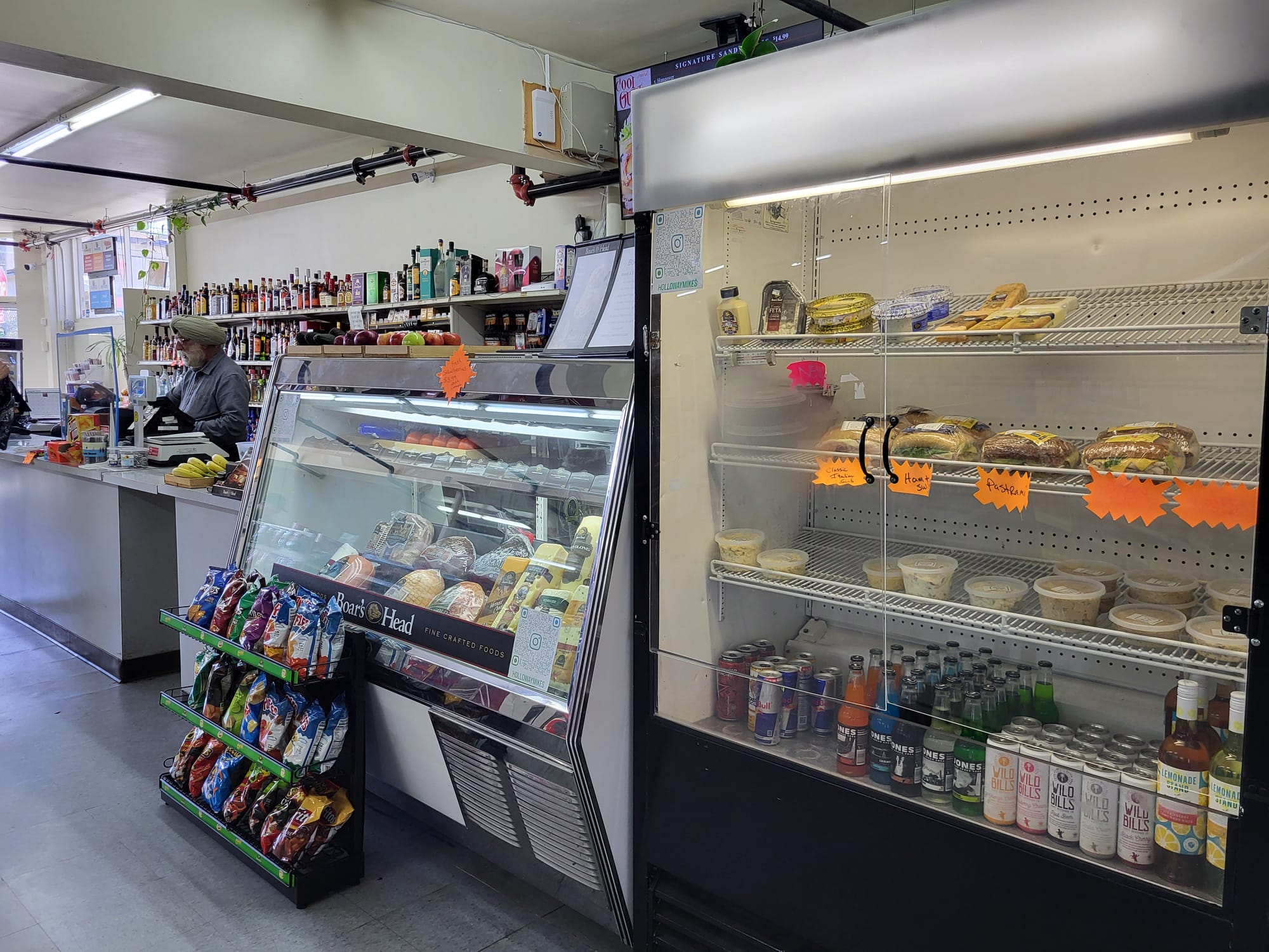 Refrigerators in a corner store.