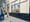 Woman walks in front of a post office.